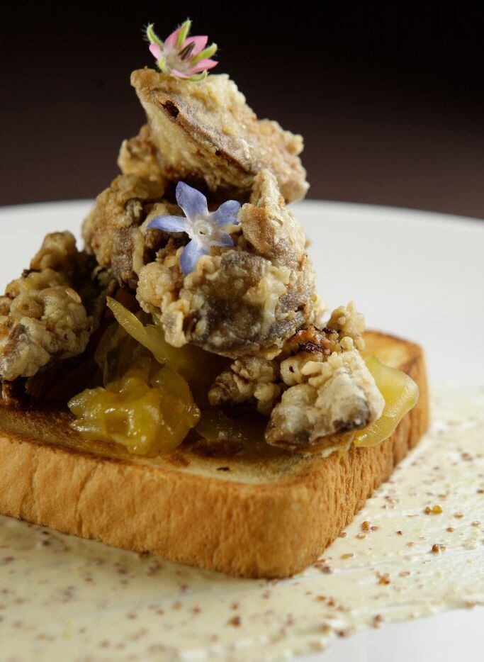 Chicken livers on Texas toast with pickled green tomato jam and creole mustard at Bootsie's...