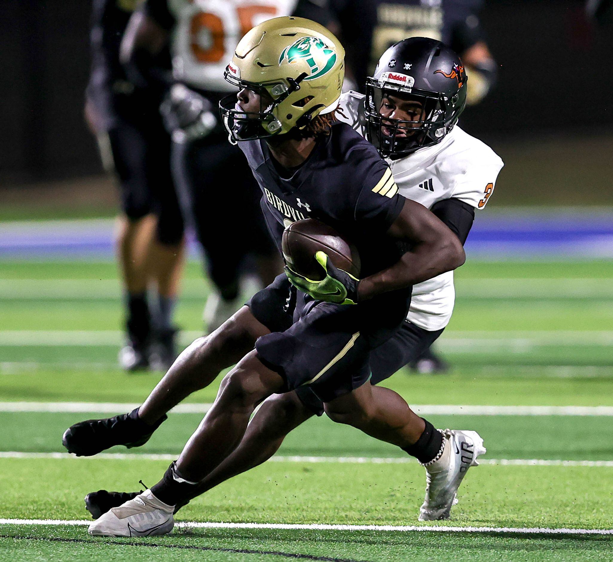 Birdville wide receiver Brian Kent (9) comes up with a reception against W.T. White...