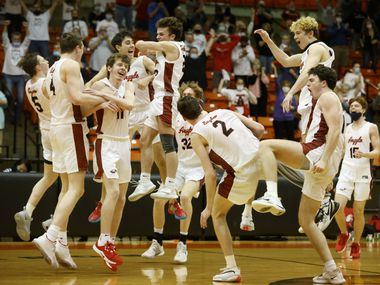 Argyle players celebrate their 43-39 victory over Oak Cliff Faith Family during a boys basketball Class 4A state semifinal in Fort Worth, Texas on March 9, 2021. (Michael Ainsworth/Special Contributor)