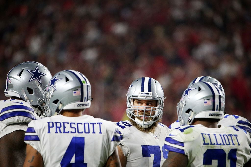 FILE - Cowboys center Travis Frederick (72) is pictured with teammates in the huddle during...