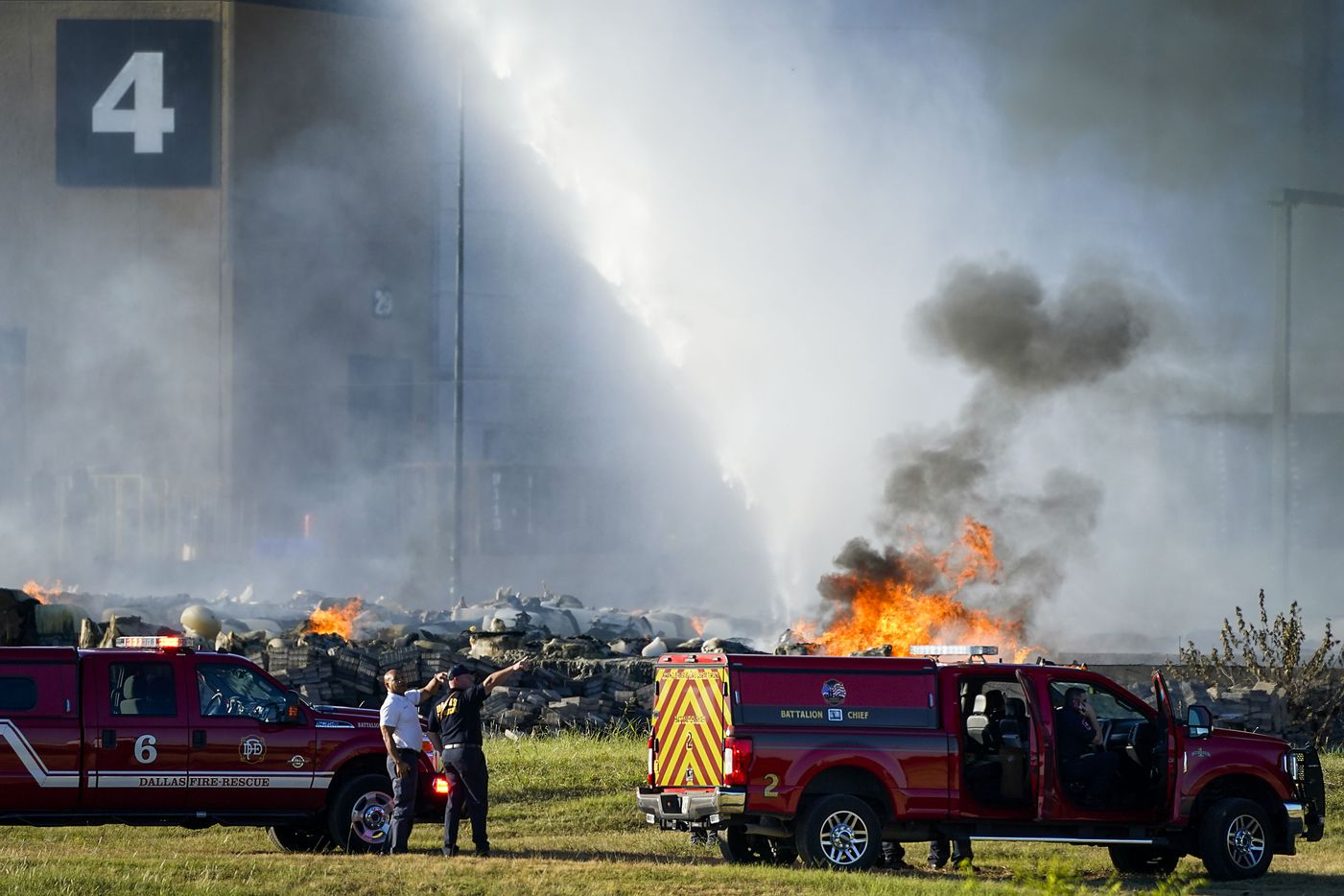 Fire crews battle a massive blaze in an industrial area of Grand Prairie on Wednesday morning, Aug. 19, 2020.