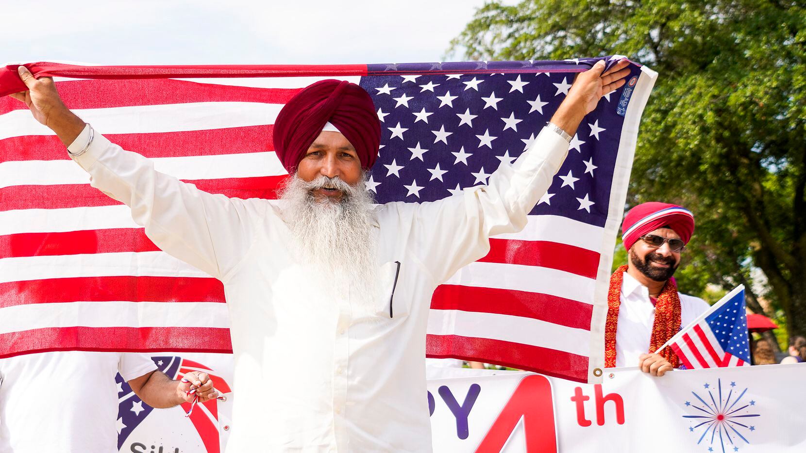 A group representing the Sikh Community of North Texas marches in the Arlington Independence...