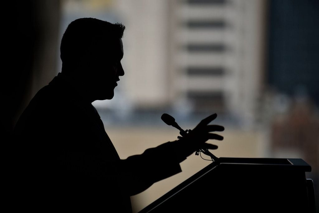 A silhouette of city councilman Adam Bazaldua of District 7 speaks during a press conference...