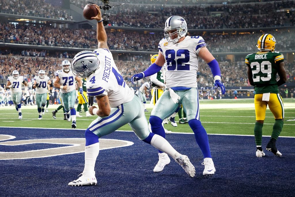 Dallas Cowboys quarterback Dak Prescott (4) spikes the ball after scoring on an 11-yard...