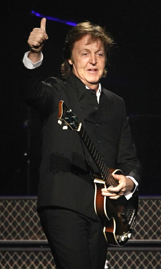 Former Beatle Paul McCartney acknowledges the crowd during his performance at the new Dallas...