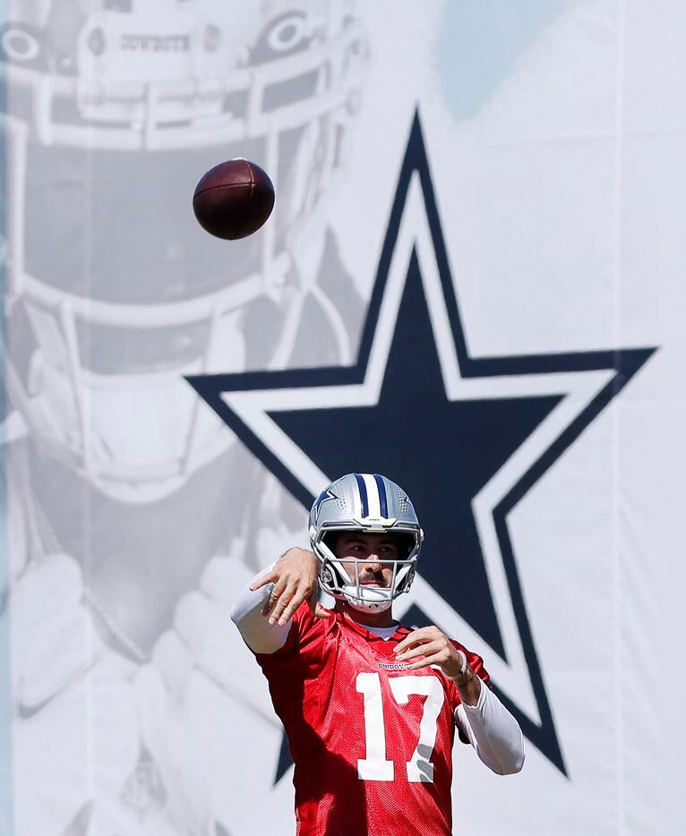 Dallas Cowboys quarterback Ben DiNucci (17) tosses a pass during a walk thru on the final...