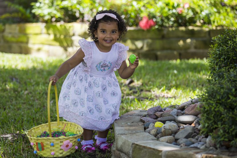Gracie Mullen hunts for Easter eggs in her front yard in Irving in 2020.