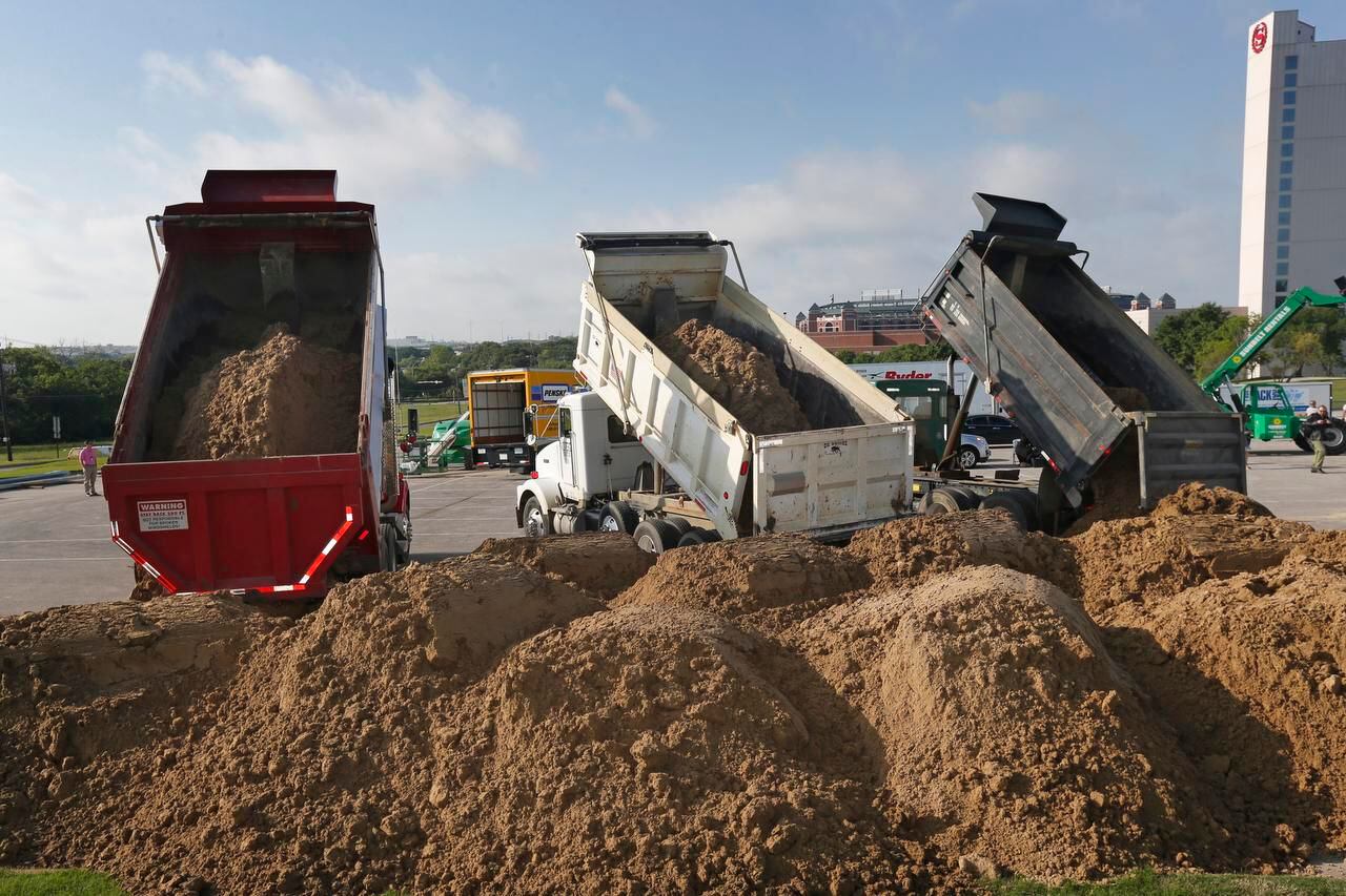 
More than 30 trucks delivered about 3 million pounds of sand Wednesday for “Fantasy in...