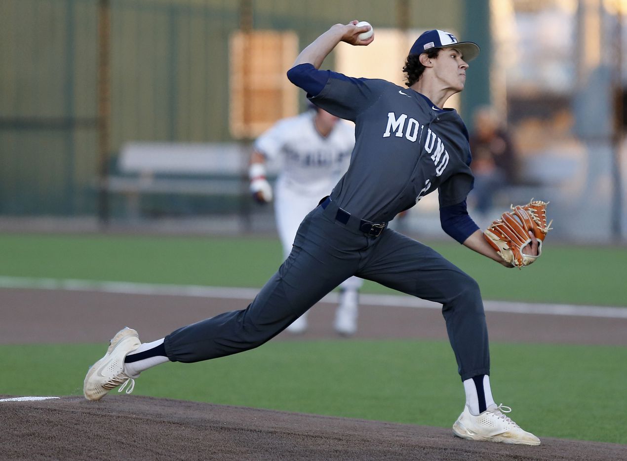 Flower Mound High School pitcher Jacob Gholston (12) throws a pitch in the second inning as...