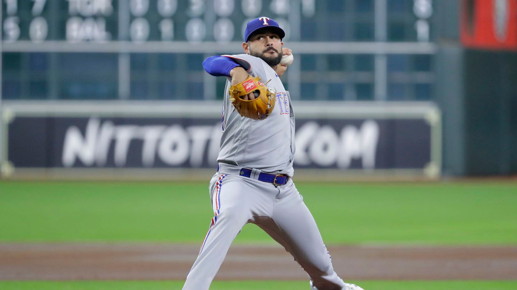 Texas Rangers starting pitcher Martin Perez throws against the Houston Astros during the...