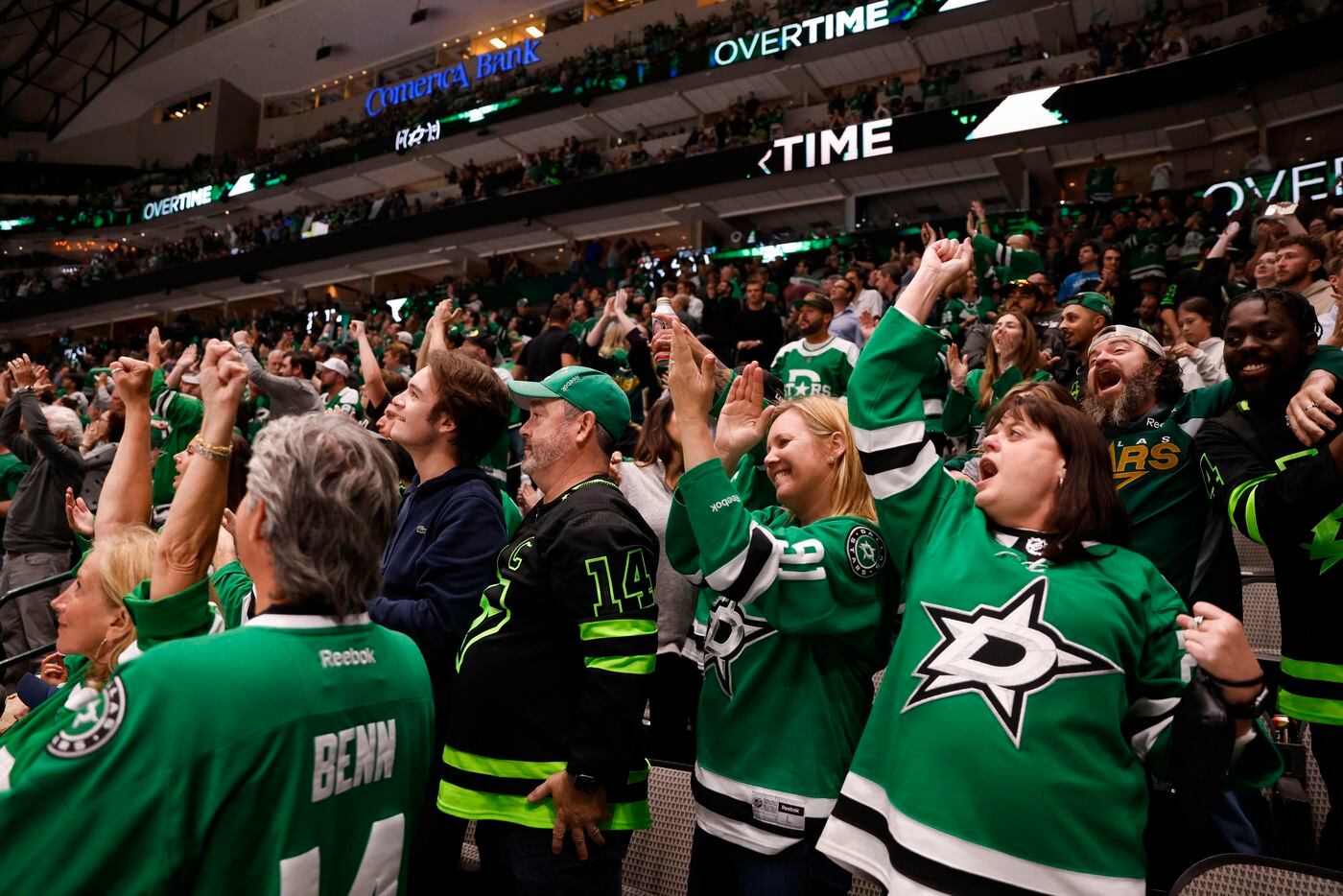 Fans celebrate the Dallas Stars clinching a playoff berth by going into overtime against the...