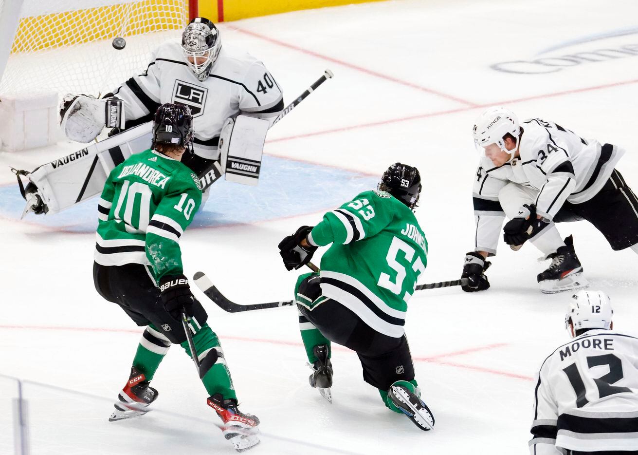 Dallas Stars center Wyatt Johnston (53) takes a shot which is deflected by Los Angeles Kings...