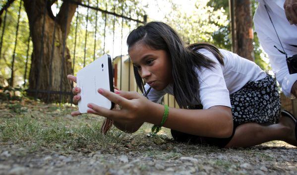 Sasha Roppolo, 13, of Richardson used a tablet to take photos that showed missing sidewalks...