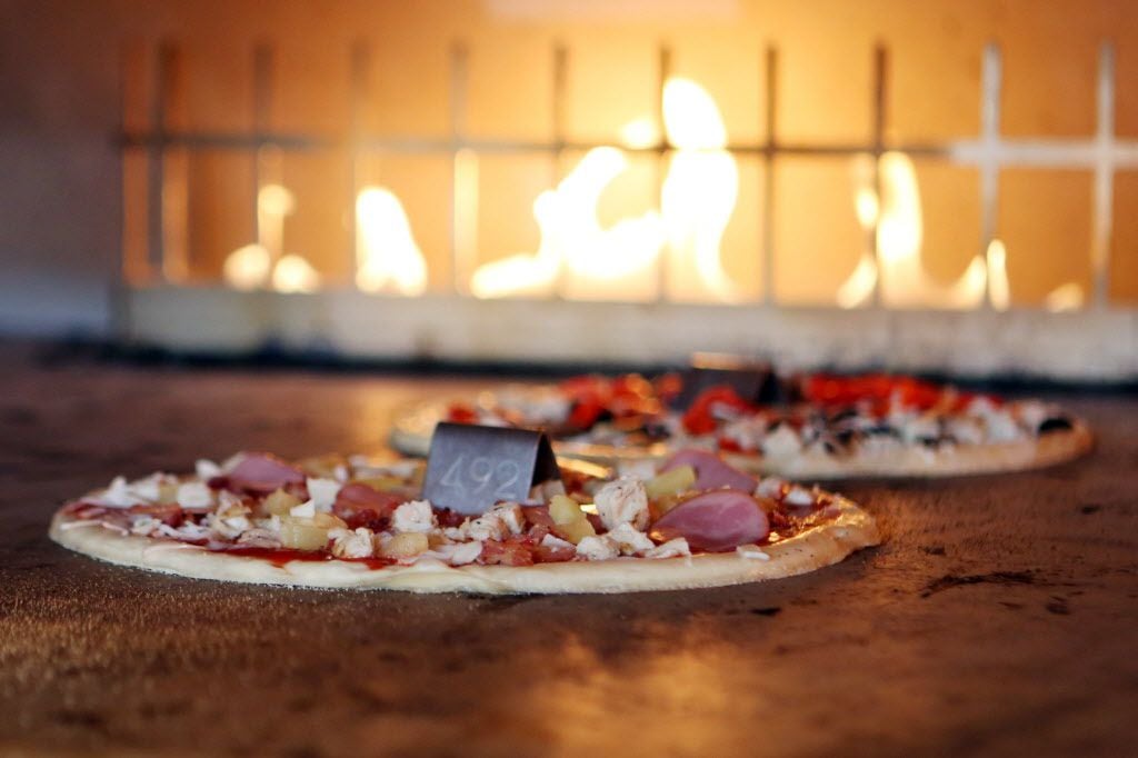 Blaze Pizza uses a hot, open-flame oven to cook 11-inch thin crust pizzas.