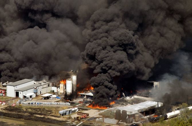 Giant plumes of black smoke rise from the Magnablend chemical processing plant in Waxahachie as a fire burns on Oct. 3, 2011. The company announced Wednesday that it had acquired and would rebuild on the long-vacant site of the shuttered superconducting super collider project.