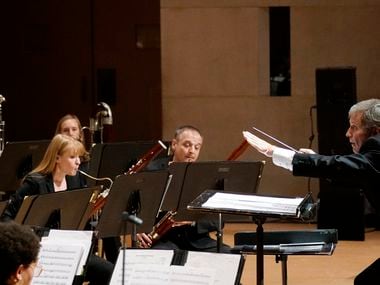 American composer Frank Ticheli conducts the Dallas Winds in the world premiere of his 'Bash!' for wind band during a concert at the Morton H. Meyerson Symphony Center in Dallas on Nov. 16.
