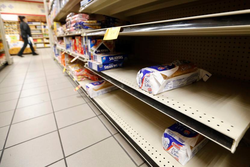Inventory of bread in the section is low at La Michoacana Meat Market in Dallas on Saturday,...