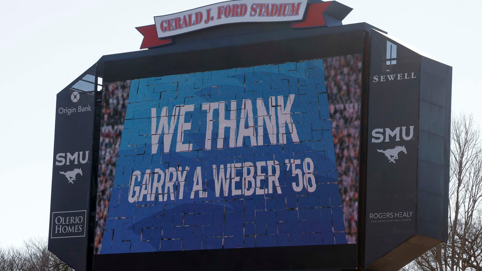 The video board displays a thank you message after a press conference announcing a $50...