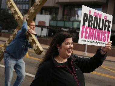 Rachel Lamb, of Richardson, Texas, who is part of the group New Wave Feminists, speaks to a...