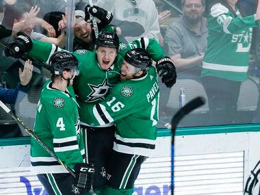 Dallas Stars forward Roope Hintz, center, is congratulated by defenseman Miro Heiskanen (4) and forward Joe Pavelski (16) after scoring a goal during the second period of an NHL hockey game against the Detroit Red Wings, Tuesday, November 16, 2021. (Brandon Wade/Special Contributor)