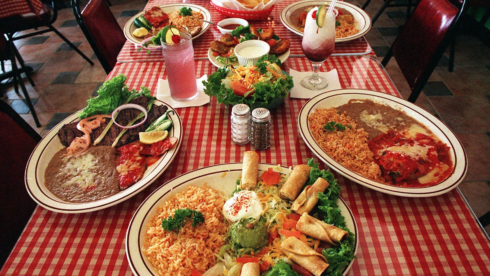 This 1998 file photo shows a table spread with food at Allen's long-running Mexi-Go restaurant.
