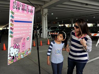 Fans decide which items to purchase at the Hello Kitty Cafe Truck at The Shops at Willow...