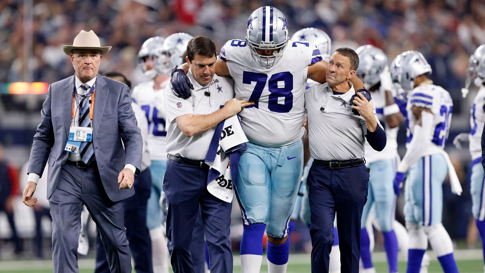 Dallas Cowboys offensive tackle Terence Steele (78) is walked to the locker room after...