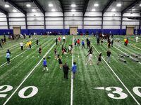 Unsigned senior football players ran drills before college scouts at the DFW Unsigned Senior...