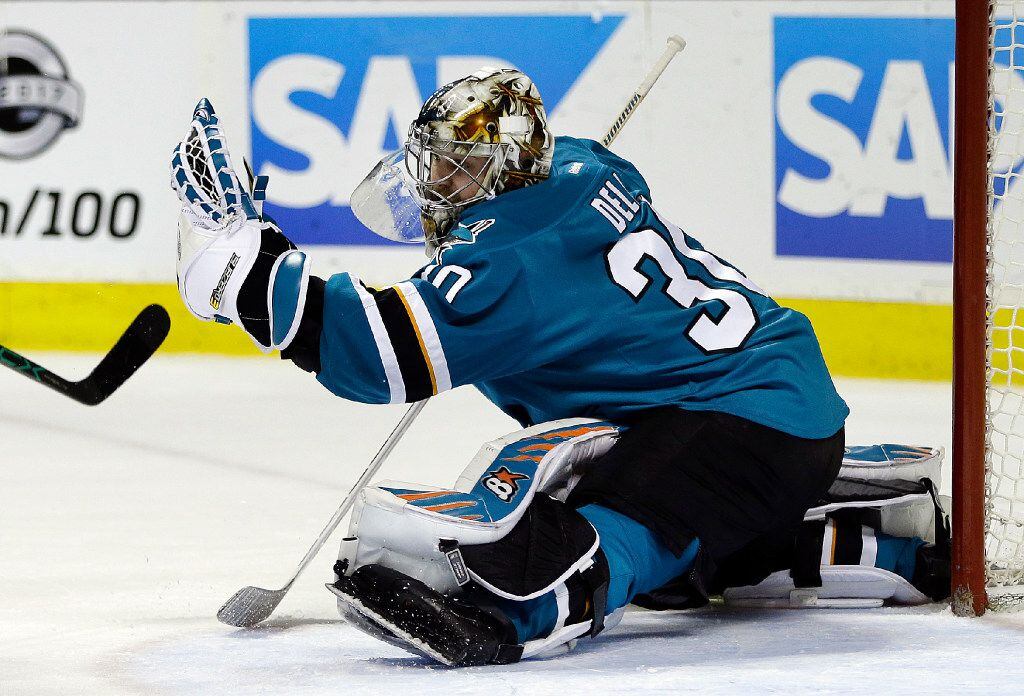 San Jose Sharks goalie Aaron Dell makes a save on a shot from the Dallas Stars during the...