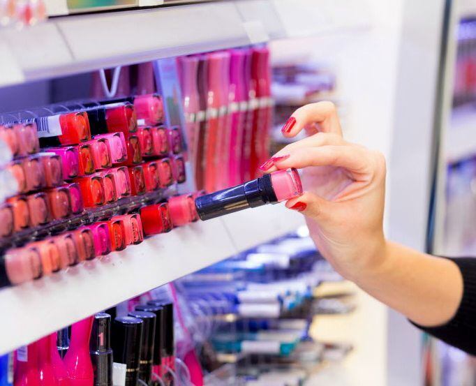 A woman shopping for lipstick
