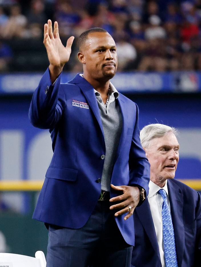 Former Texas Rangers third baseman Adrian Beltre (left) waves to fans after his Texas Rangers Baseball Hall of Fame induction speech at Globe Life Field in Arlington, Saturday, August 14, 2021. Executive vice president and public address announcer Chuck Morgan was also inducted. (Tom Fox/The Dallas Morning News)