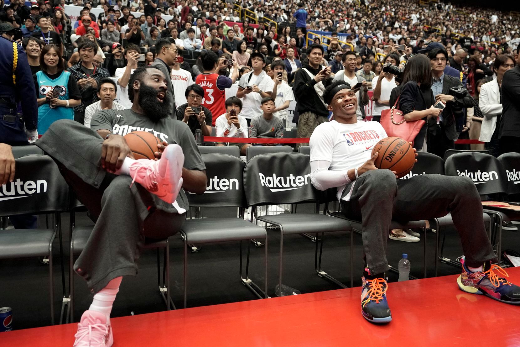 FILE - Rockets guards James Harden, left, and Russell Westbrook share a light moment during...