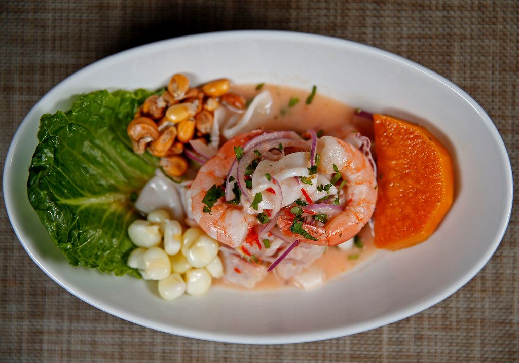 Ceviche mixto features white fish, shrimp and calamari, tossed with lime juice, ginger,...