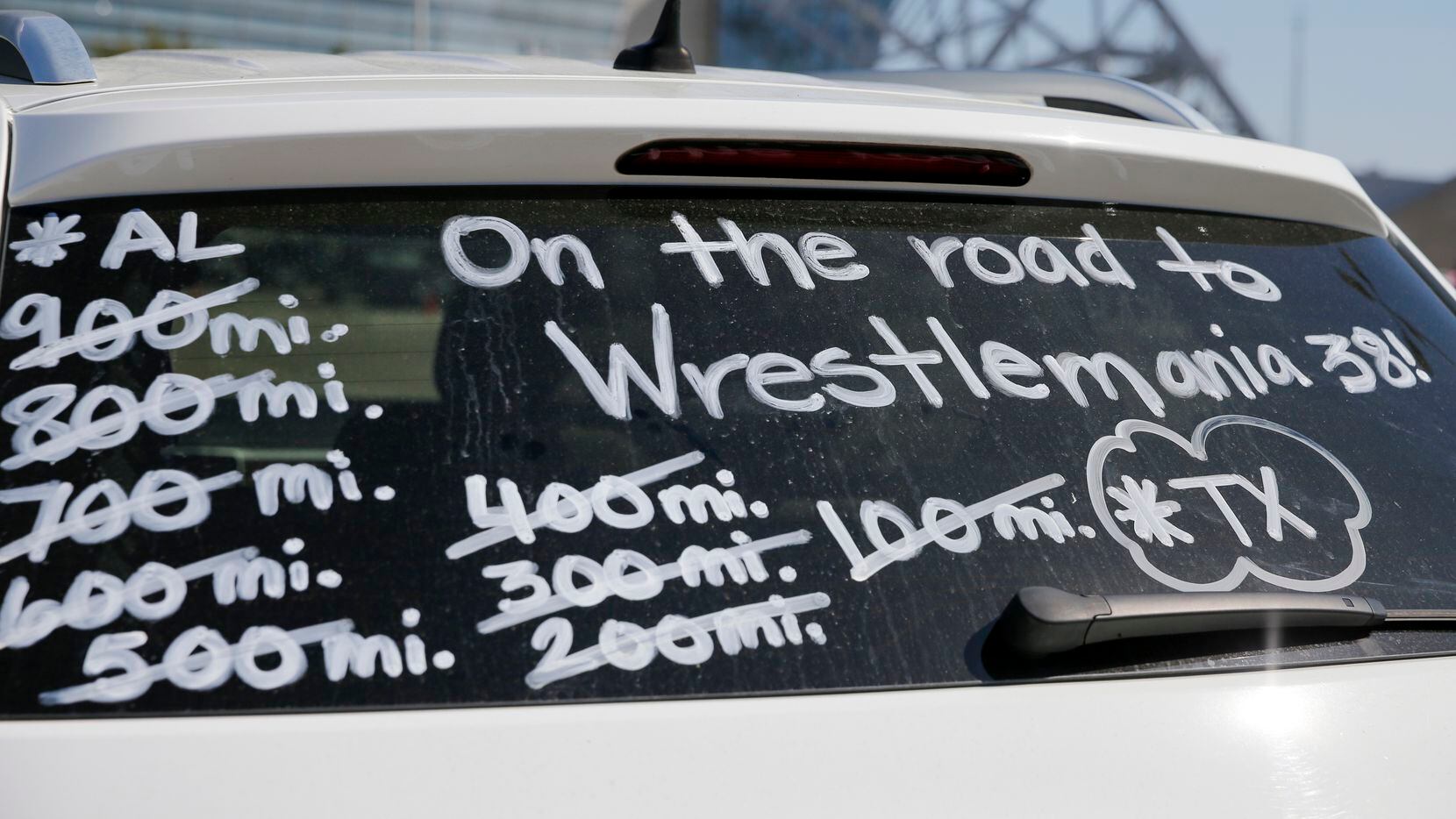 Window paint on a car documents a fan’s roadtrip outside WrestleMania 38 at AT&T Stadium.
