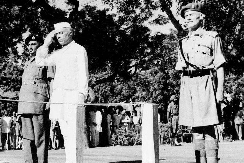 Jawaharlal Nehru salutes the flag as he becomes independent India's first prime minister on...