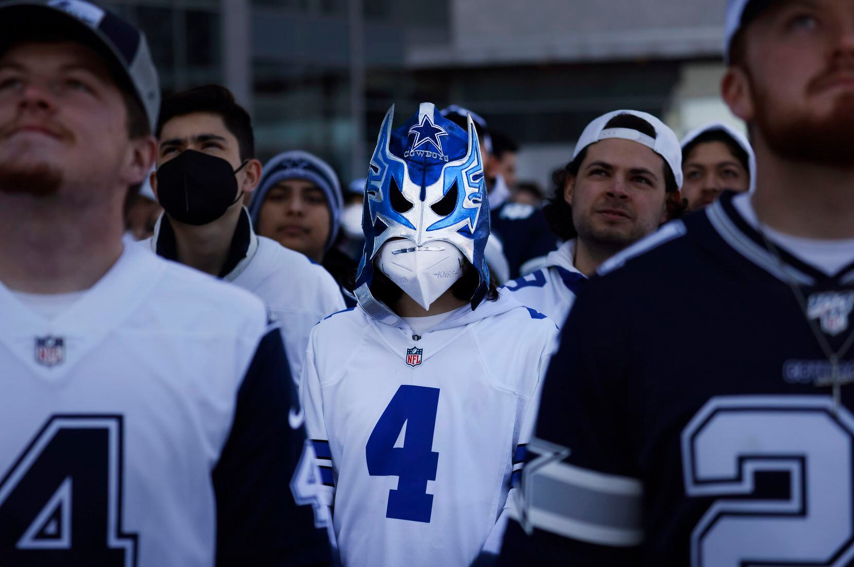 Dallas Cowboys fan Leonardo Saurez, 13, of Mexico City dons his lucha libra mask as fans...