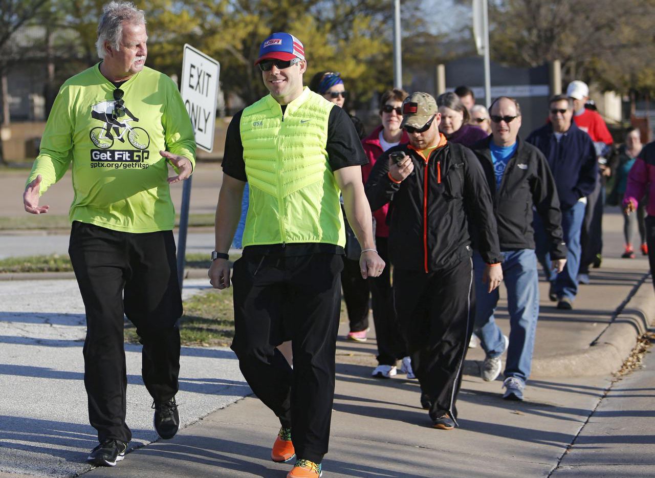 Grand Prairie Mayor Ron Jensen (left) is pictured in a file photo on a Strollin' with the...