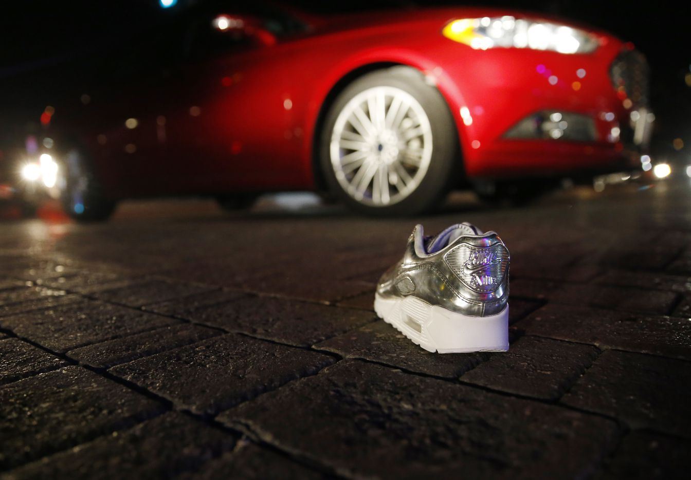 A lone shoe from one of the stores sits in the middle of Main Street in Deep Ellum in...