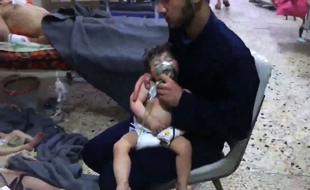An image grab taken from a video released by the Syrian civil defence in Douma shows an...