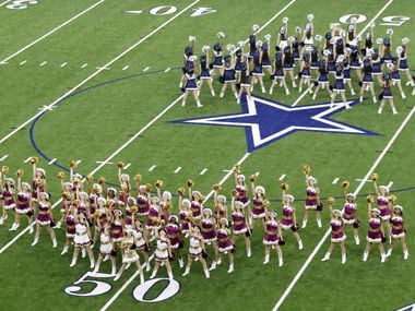Heritage High School and Lone Star High School perform simultaneously during halftime during...
