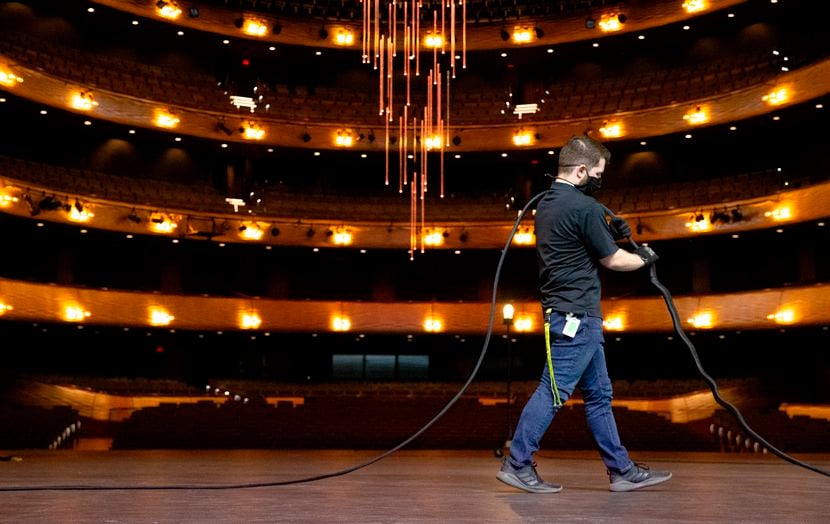 Jonathan White, head audio at the Winspear Opera House, does maintenance prep by making...