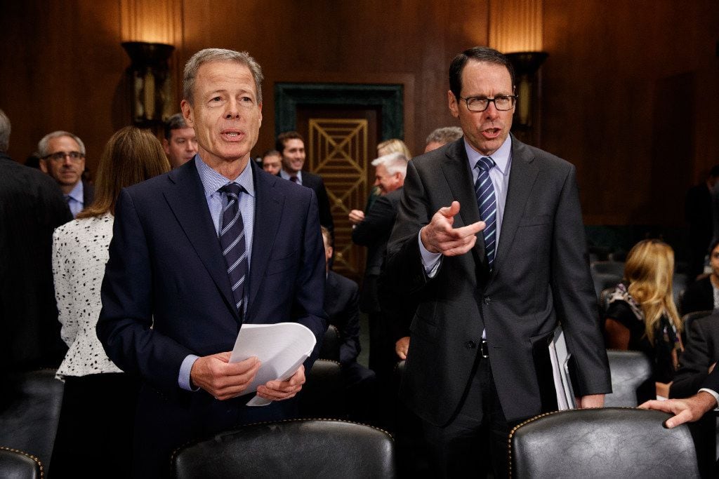 AT&T chairman and CEO Randall Stephenson (right) and Time Warner chairman and CEO Jeffrey...