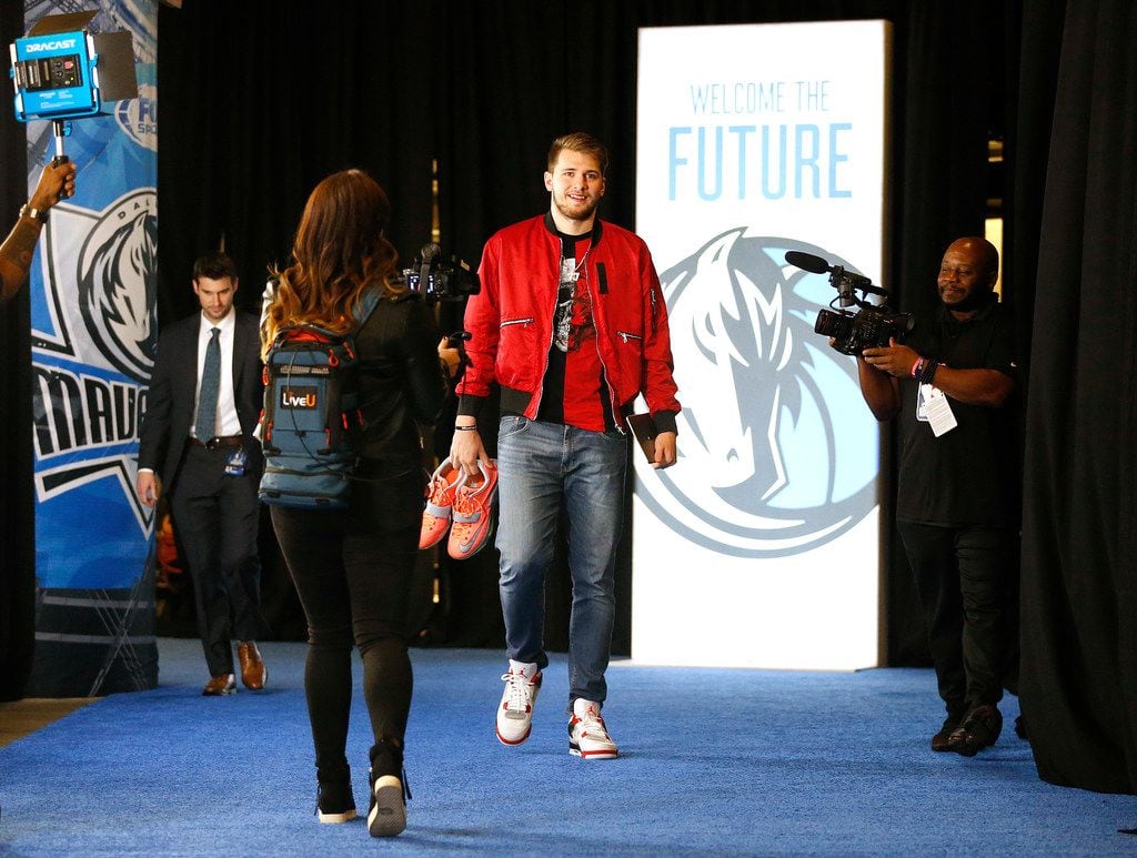 Dallas Mavericks guard Luka Doncic arrives for his first home game at the American Airlines...
