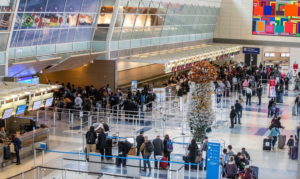 Four days before Christmas, travelers waited through long security lines at DFW International Airport's Terminal D.