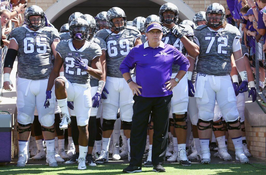 Head coach Gary Patterson of the TCU Horned Frogs leads his team onto the field to take on...