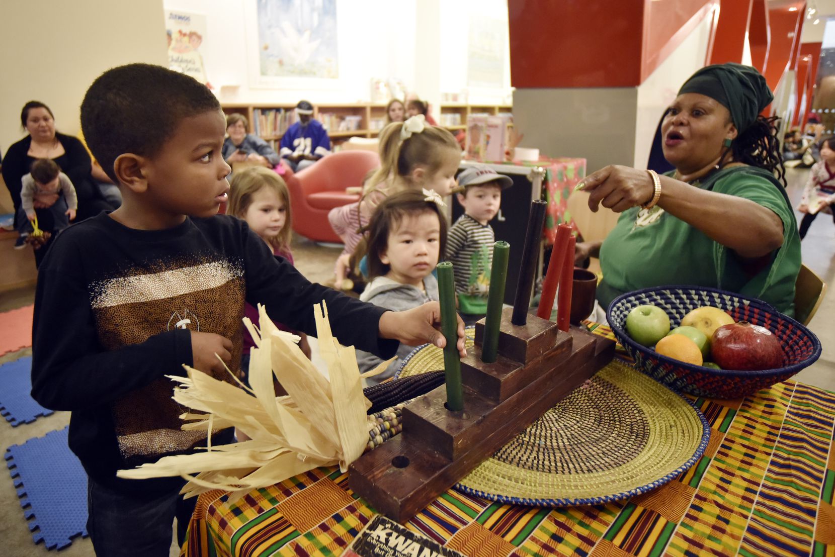 Afiah Bey (far right), a griot who was a staple at Kwanzaa celebrations, will be honored at...