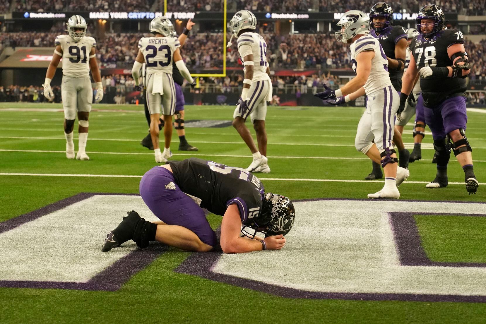 TCU quarterback Max Duggan (15) kneels in the end zone after rushing for a touchdown in the...