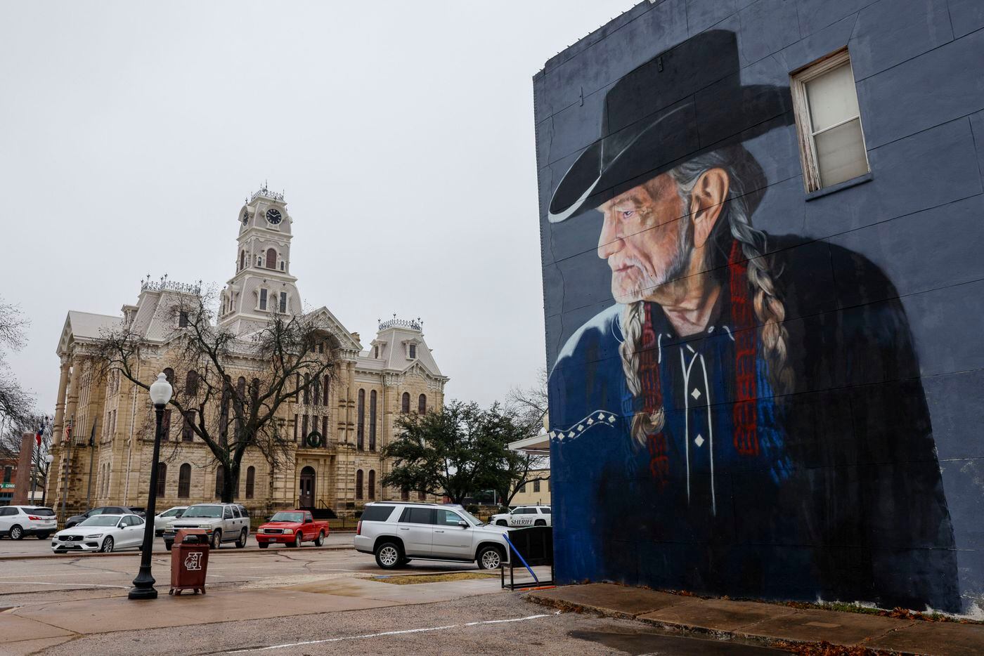 A mural of country singer Willie Nelson overlooks the Hill County Courthouse, Tuesday, Jan....