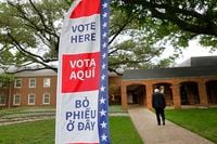 A sign that reads,” Vote Here,” is seen in front of University Park United Methodist Church,...