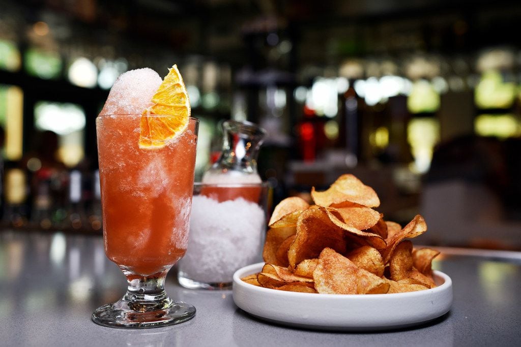 The negroni snow cone cocktail with giardiniera-dusted potato chips. 